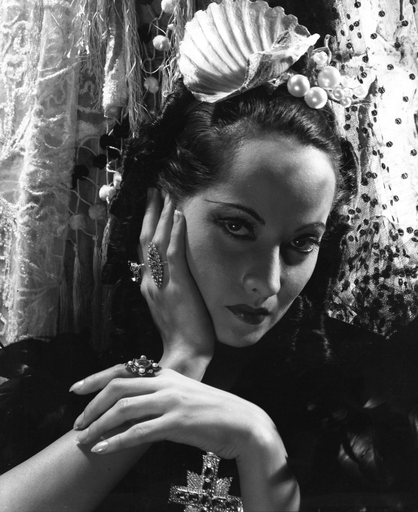 Merle Oberon (1911-1979), Actress, wearing a pearl headdress designed by Cecil Beaton and costume by Oliver Messel, on the set of ‘The Private Life of Don Juan’, photograph by Cecil Beaton, 1934.  Courtesy of The Cecil Beaton Studio Archive, Sotheby’s 